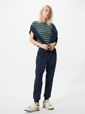 A model wearing the women's jogger pants standing against a plain white background.