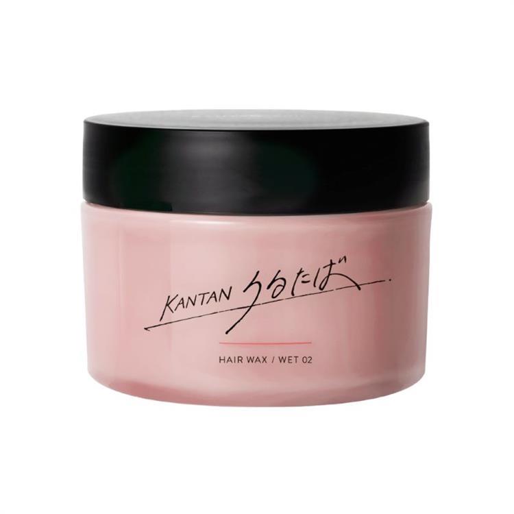 Pink jar of うるたば hair wax with a black lid and product label.