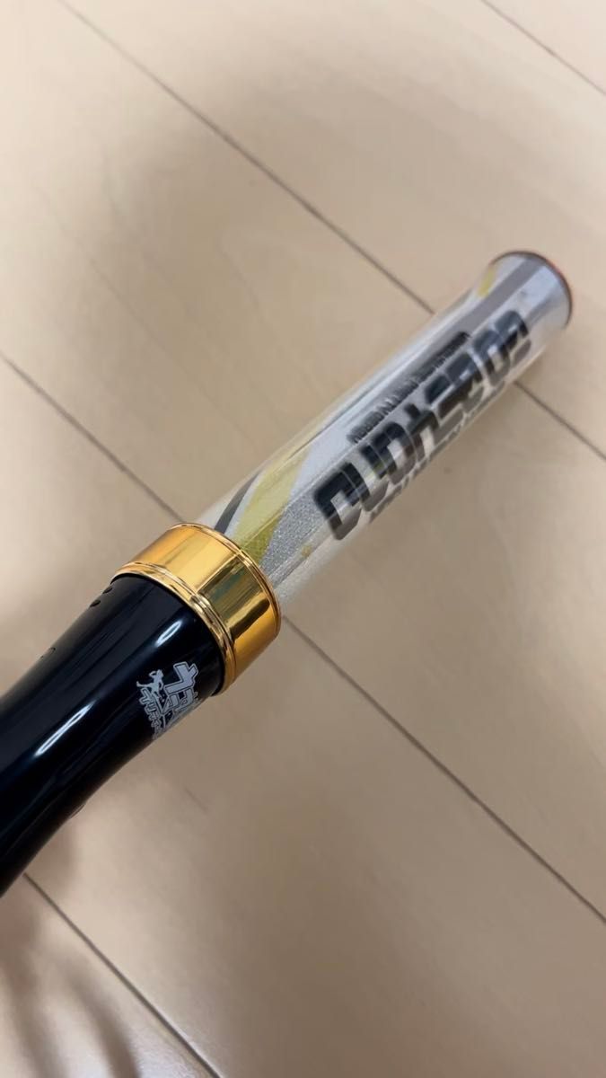 Close-up of the ウマ娘 プリティーダービー 5th EVENT ARENA TOUR GO BEYOND penlight showing the handle and clear light tube.