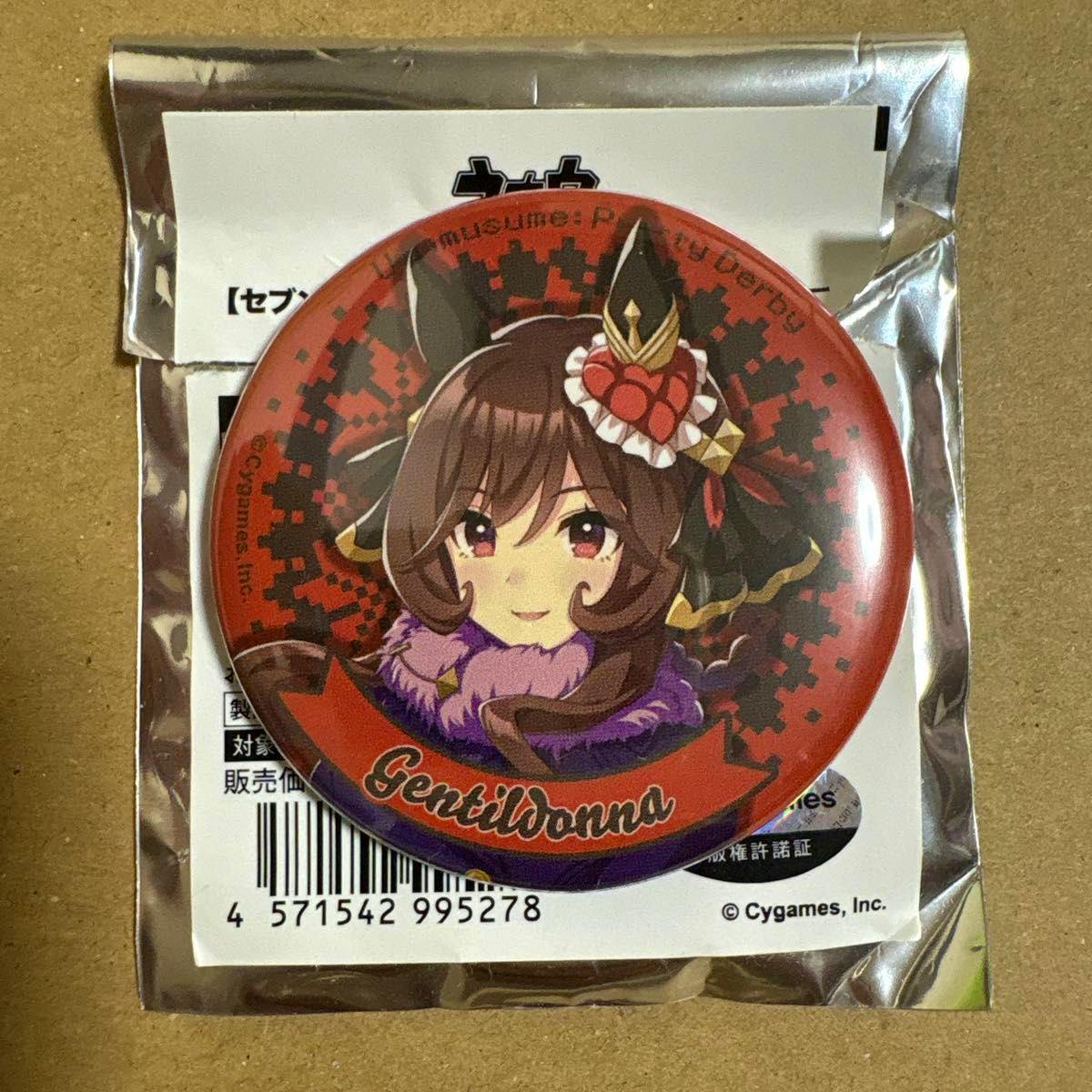 A round can badge showing the Gentildonna anime character's face on a red patterned background, displayed in its sealed foil packaging.