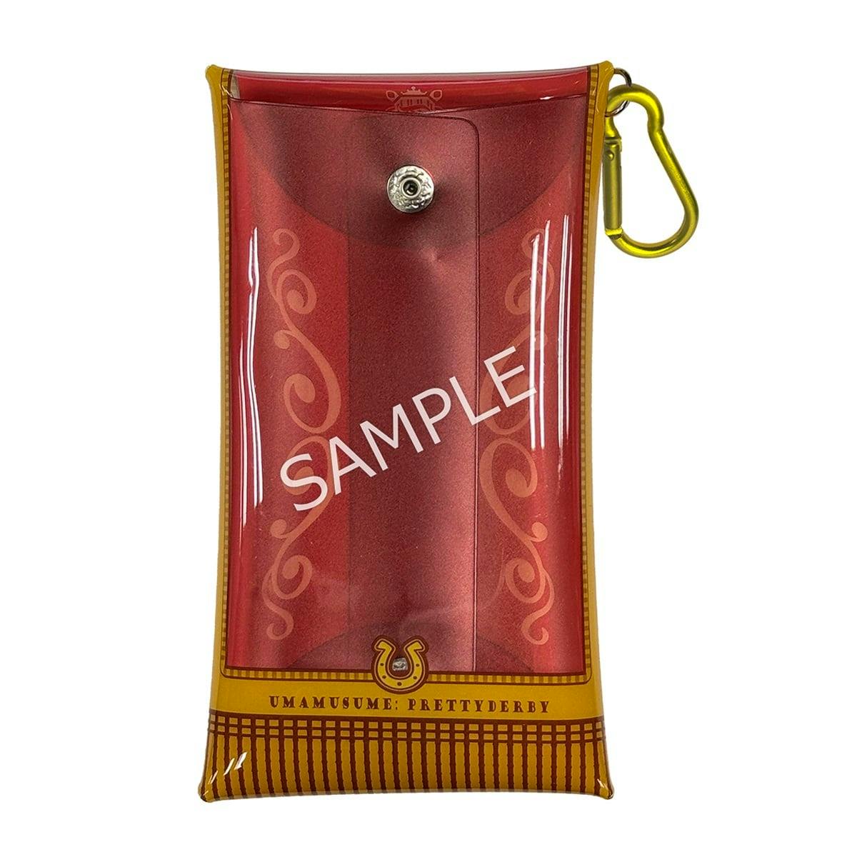 Front-facing photo of the Umamusume: Pretty Derby multi pouch (Rei), a red plastic case with yellow trim, carabiner, and a ‘SAMPLE’ watermark.