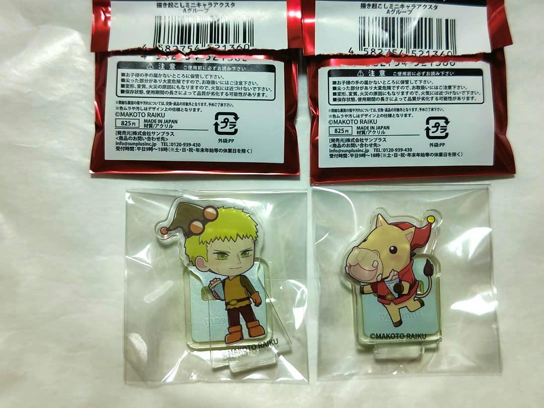 Two packaged acrylic mini character decorative stands showing the front character art with red header labels.