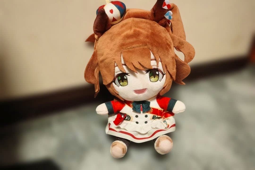 Front view of the ウマ娘ぬいぐるみマスコット アストンマーチャン plush showing its face, outfit, and ponytail.