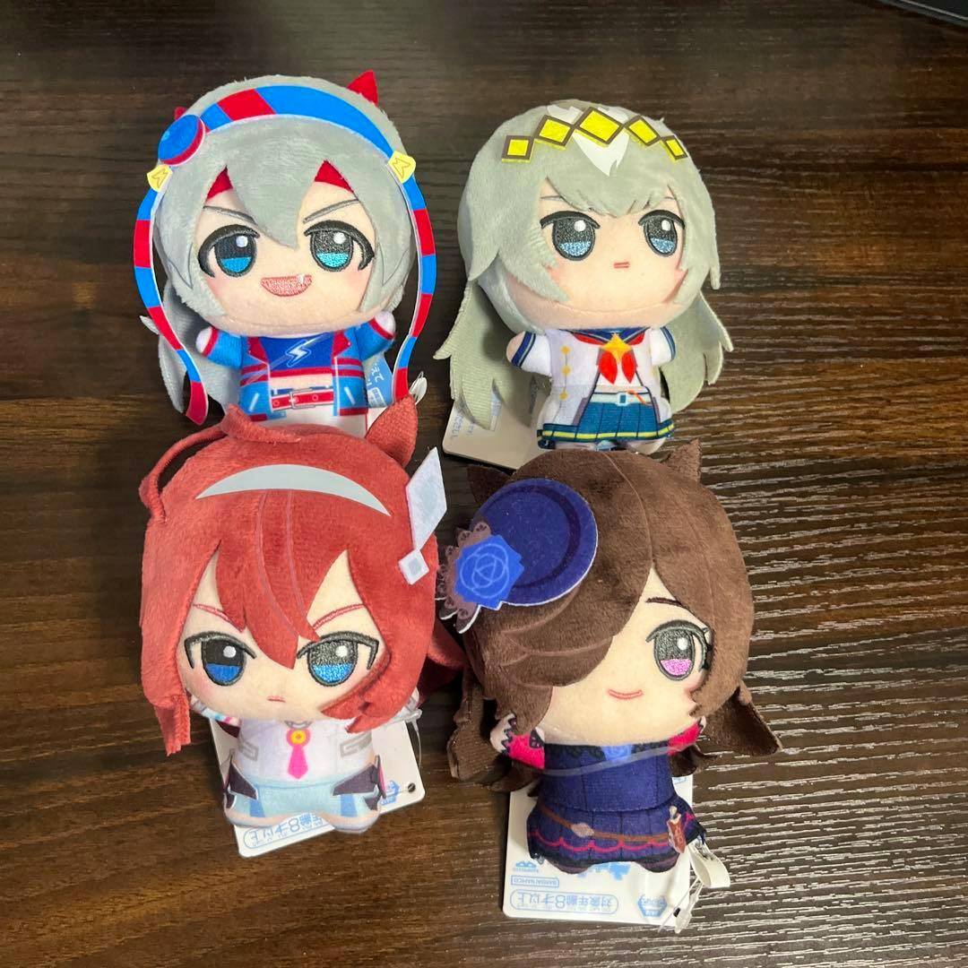 Four Umamusume Pretty Derby chibi plush toys (Vol.3, full 4-piece set) arranged on a wooden surface.