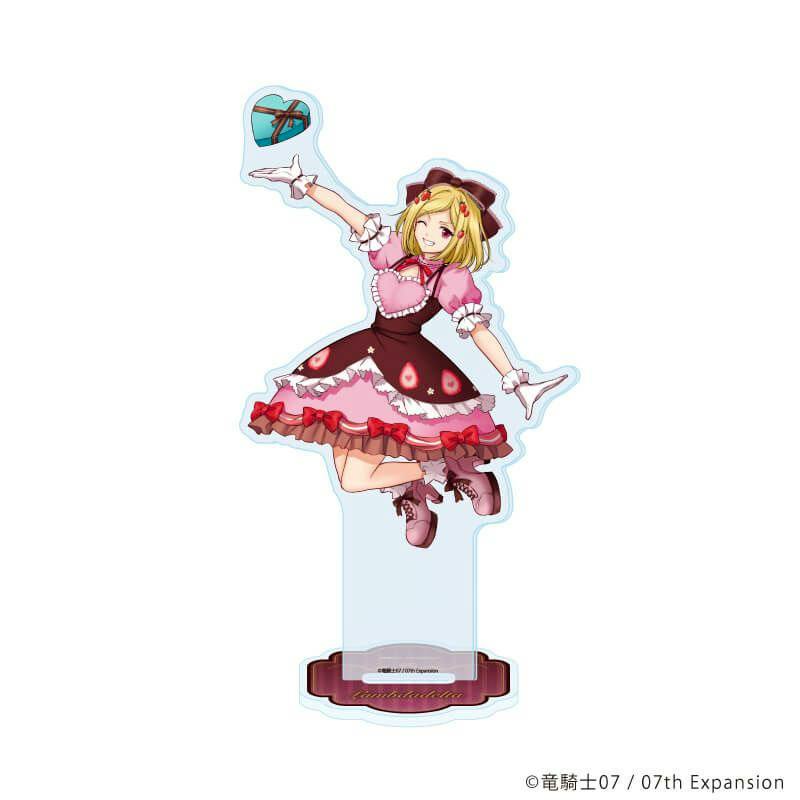 Acrylic stand showing Lambda Delta in a pink and brown dress illustration with a clear support and decorative base.