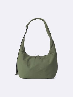 Olive-green nylon shoulder bag with a single strap and top zip closure shown on a plain background.