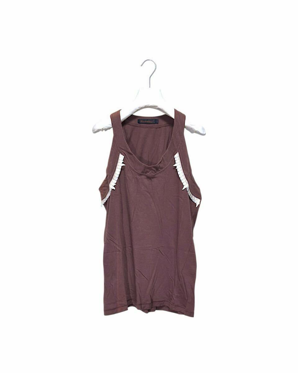 Brown sleeveless women’s cotton shirt/top hanging on a white hanger against a white background.