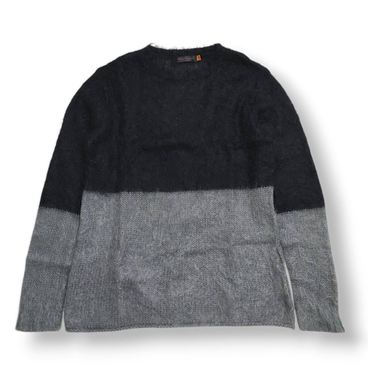 Two-tone black and gray mohair knit sweater laid flat on a white background.