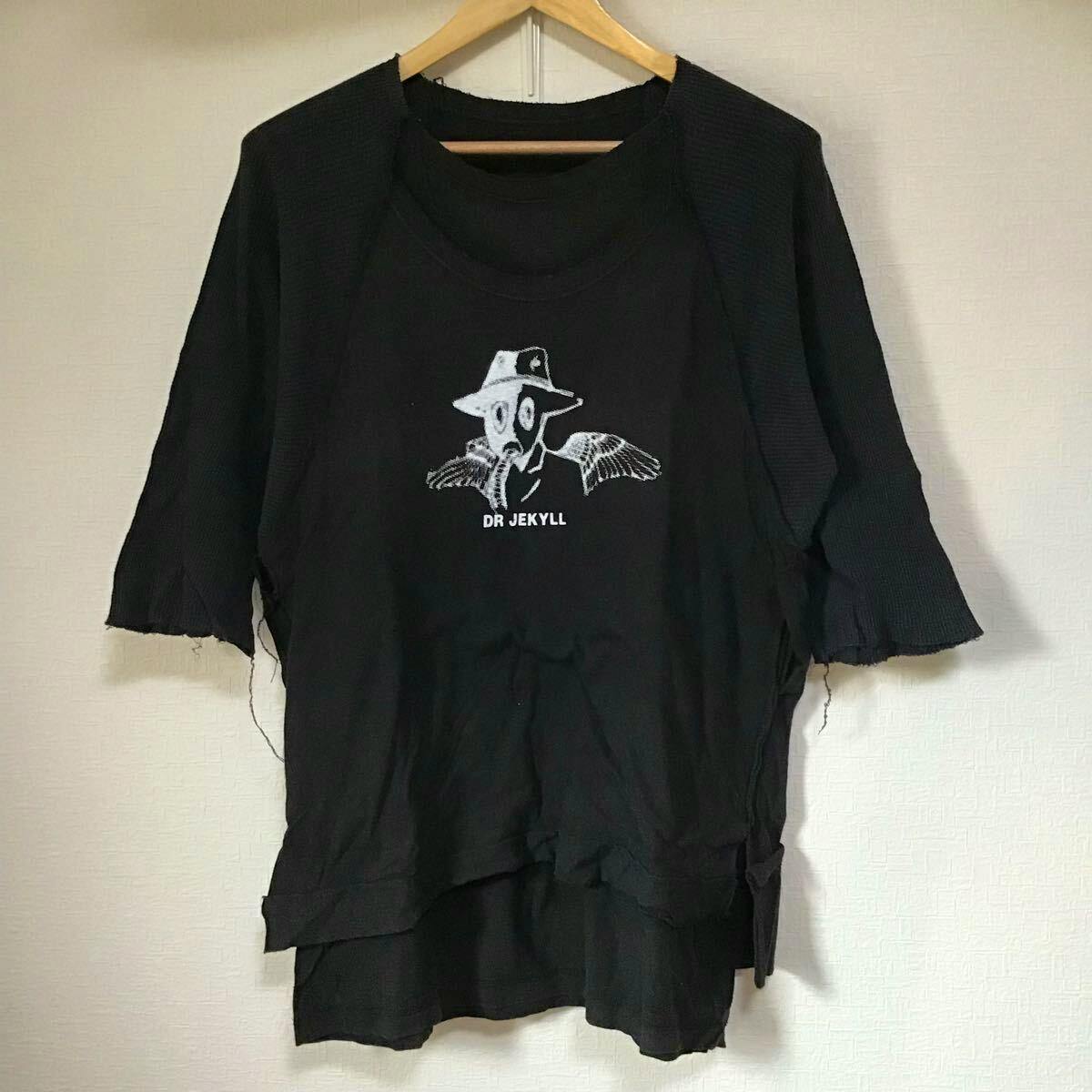 Black layered, distressed women's cotton T-shirt/dress with a "DR JEKYLL" graphic hanging on a wooden hanger.