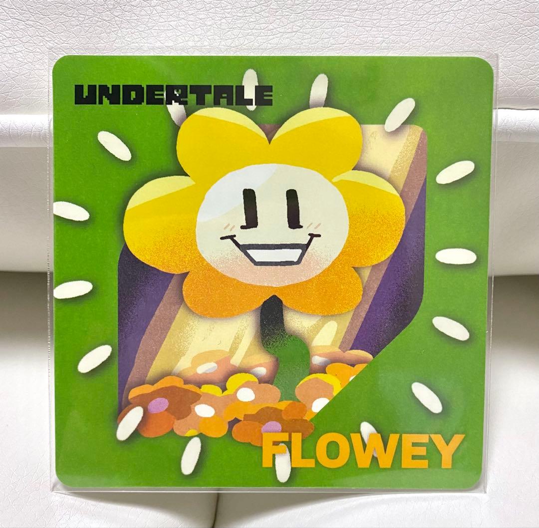 Paper coaster featuring the Undertale character Flowey on a green background with the words “UNDERTALE” and “FLOWEY” visible.