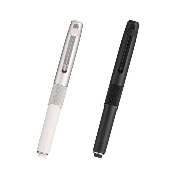 Two uniball ZENTO3 ballpoint pens, one silver/white and one matte black, on a white background.