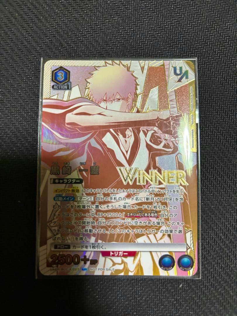 Front photo of the trading card showing Kurosaki Ichigo illustration with gold "WINNER" foil and Japanese card text.