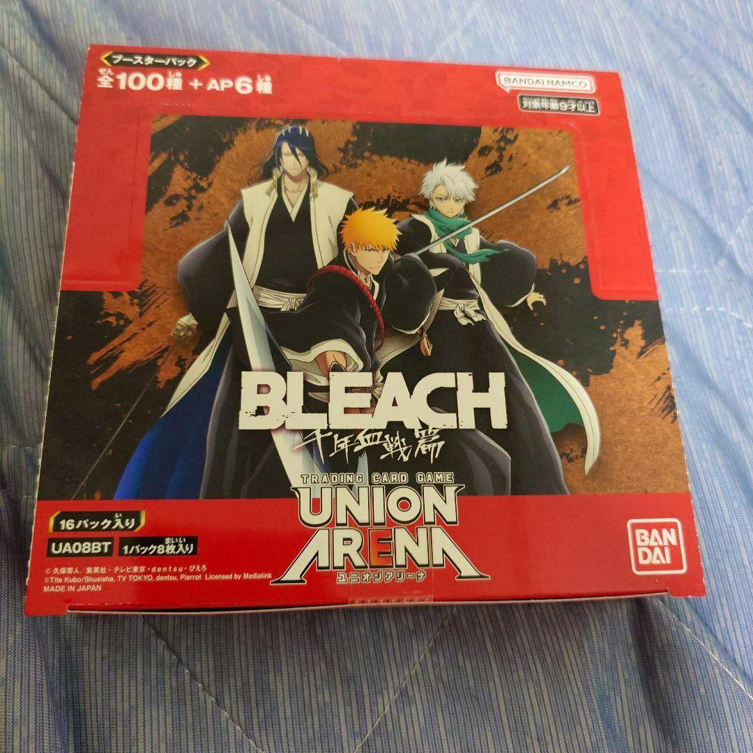 Photo of the BLEACH Union Arena trading card game 1BOX packaging showing character artwork and branding.