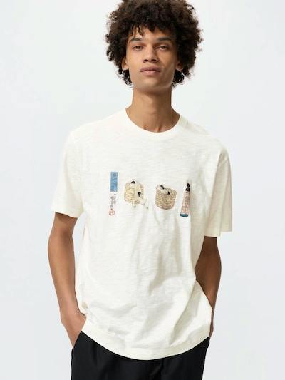 Male model wearing a light cream men's cotton T-shirt featuring a small ukiyo-e animal graphic across the chest.