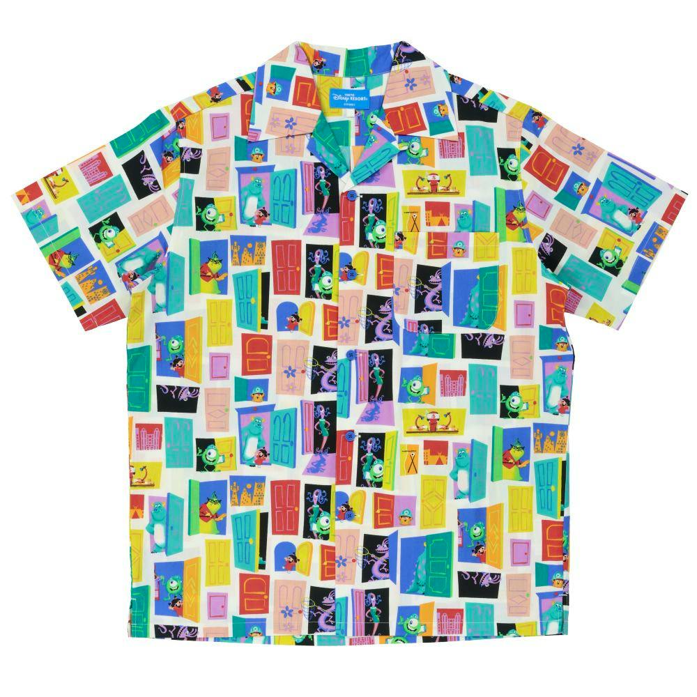 Flat-lay photo of a unisex aloha shirt with a colorful all-over door-and-character print on a white background.