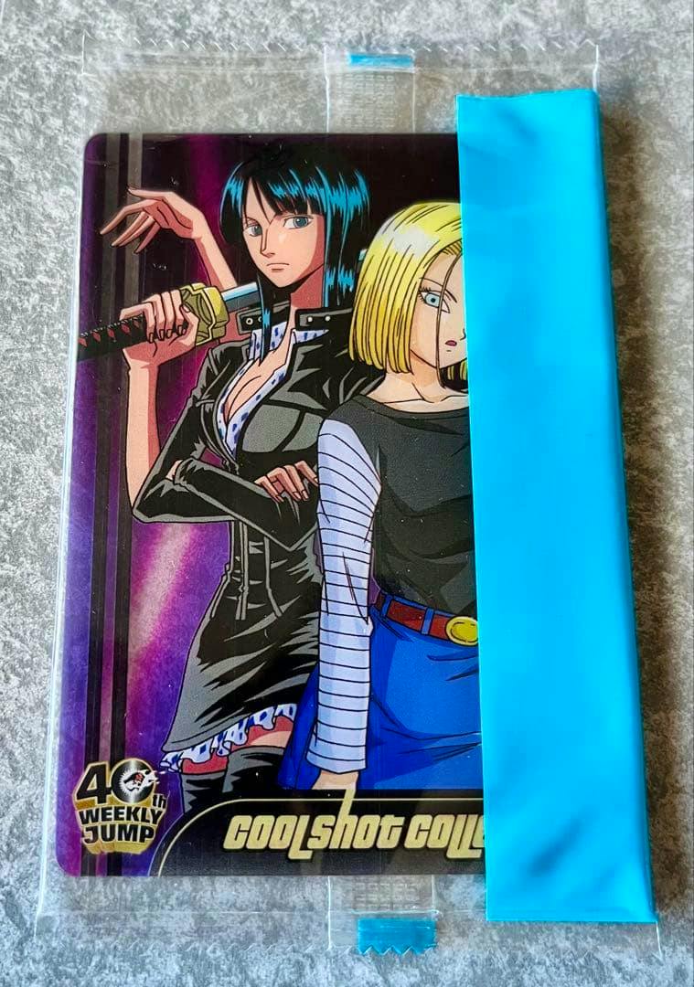 Front of the sealed Dragon Ball × One Piece Jump 40th anniversary photocard showing two characters inside a clear plastic sleeve with a blue wrapper.