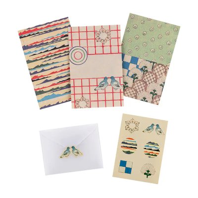 Unsodo: Bijutsukai mini letter set showing three patterned mini writing sheets, a white envelope with a bird sticker, and a small sticker sheet.