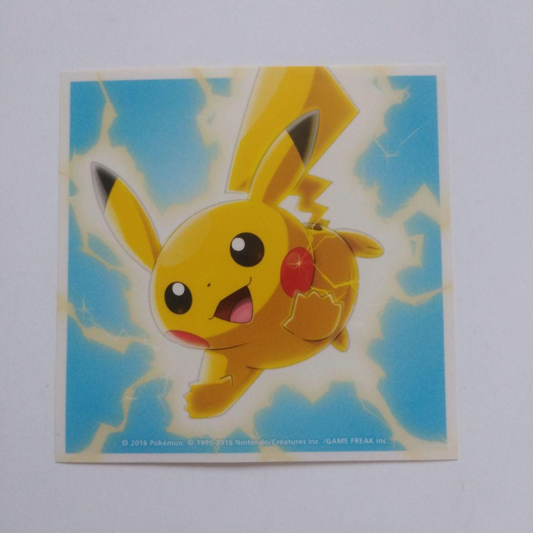 Square paper sticker front showing Pikachu against a blue background with lightning effects.