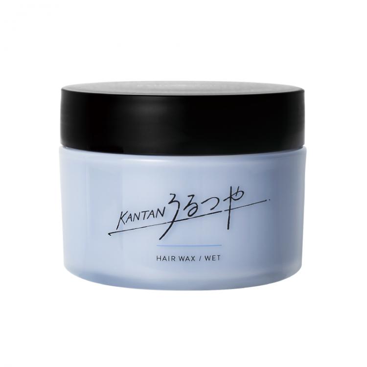 A jar of うるつや hair wax with a black lid on a white background.
