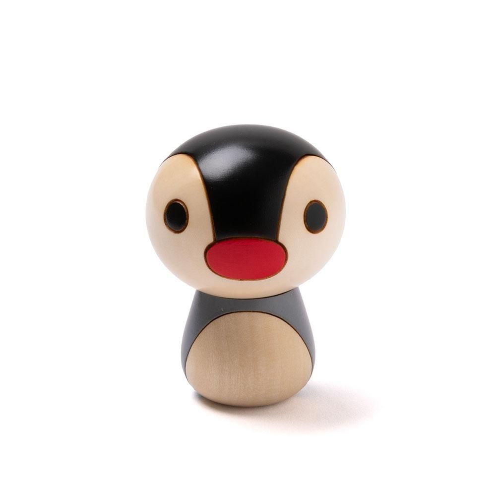 Wooden kokeshi-style figure (ピンガ) with a black head, round eyes, a red mouth, and a natural wood-colored body on a white background.
