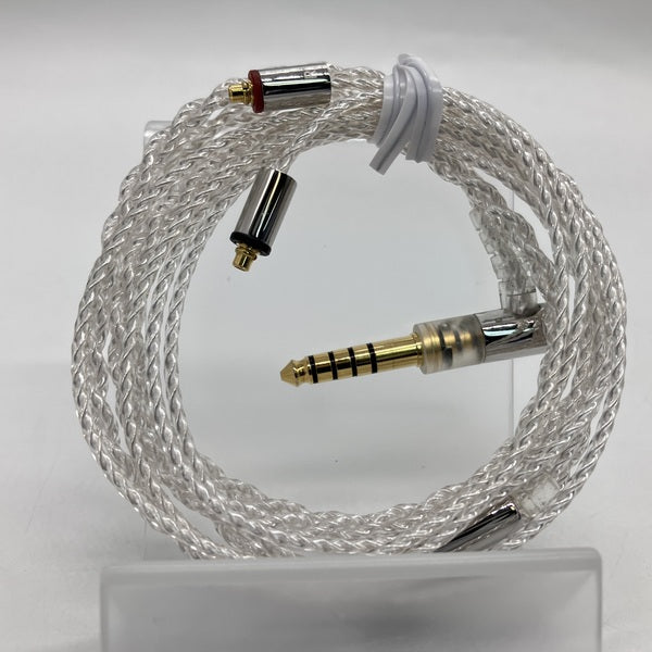 Coiled silver-coated MMCX AUX cable showing a gold-plated 4.4mm 5-pole balanced plug and MMCX connectors.