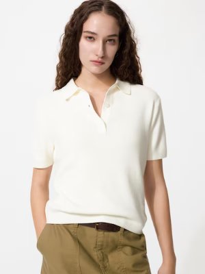 Model wearing the product: a white cotton short-sleeve top with a collar.