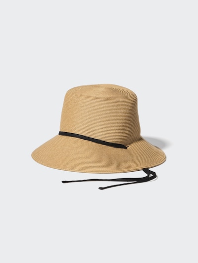 A beige UV-cut paper-braid hat with a black ribbon and long black chin ties on a light background.