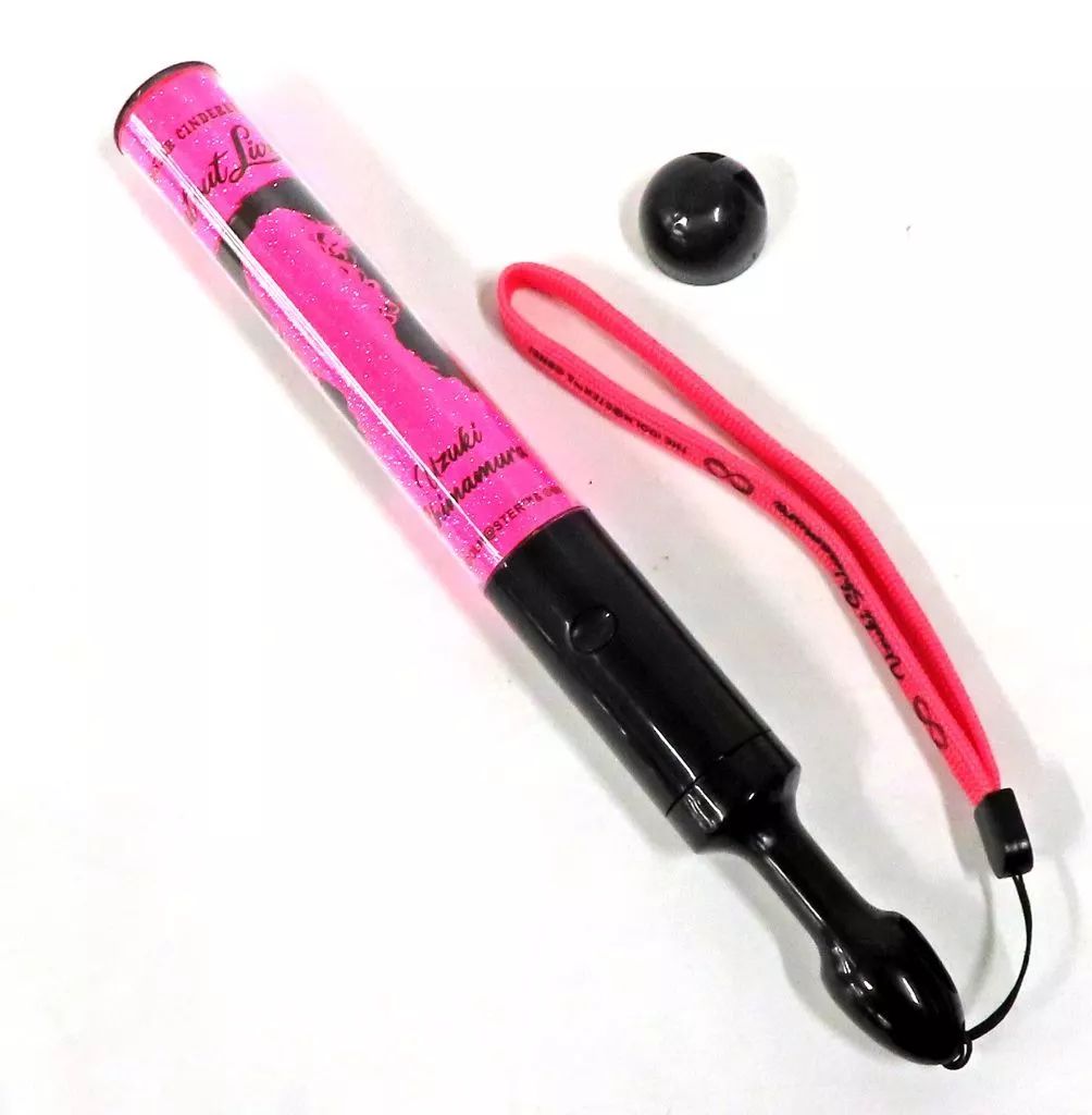 Pink Shimamura Uzuki (Shout out Live!!! ver.) pen light with black handle, pink wrist strap, and small black cap on a white background.