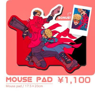Photo of the V&V’s mouse pad showing a die-cut pad with a printed illustration of two characters, a small bonus polaroid image, and the text "MOUSE PAD ¥1,100".