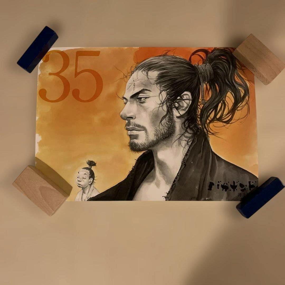 Poster of バガボンド volume 35 cover showing a side-profile illustration of a man with a ponytail and a smaller figure, with a large "35" on an orange background.