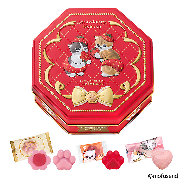 Red octagonal tin with cat illustrations and several individually wrapped and unwrapped pink and red strawberry- and paw-shaped chocolates displayed in front.