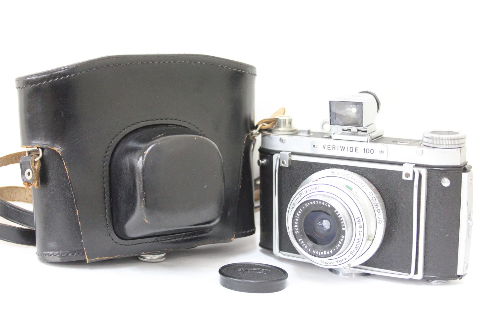 Front three-quarter view of a Veriwide 100 film camera with its lens cap and a black leather carrying case.