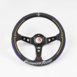 Front view of the steering wheel showing a three-spoke design, center hub, and branded rim.
