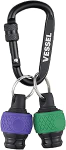 Black aluminum carabiner holding two bit-holder attachments, one green and one violet, each on a split ring.