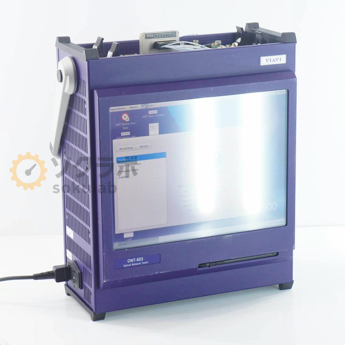 Front view of a purple ONT-603 Optical Network Tester showing its screen and connected power cable.