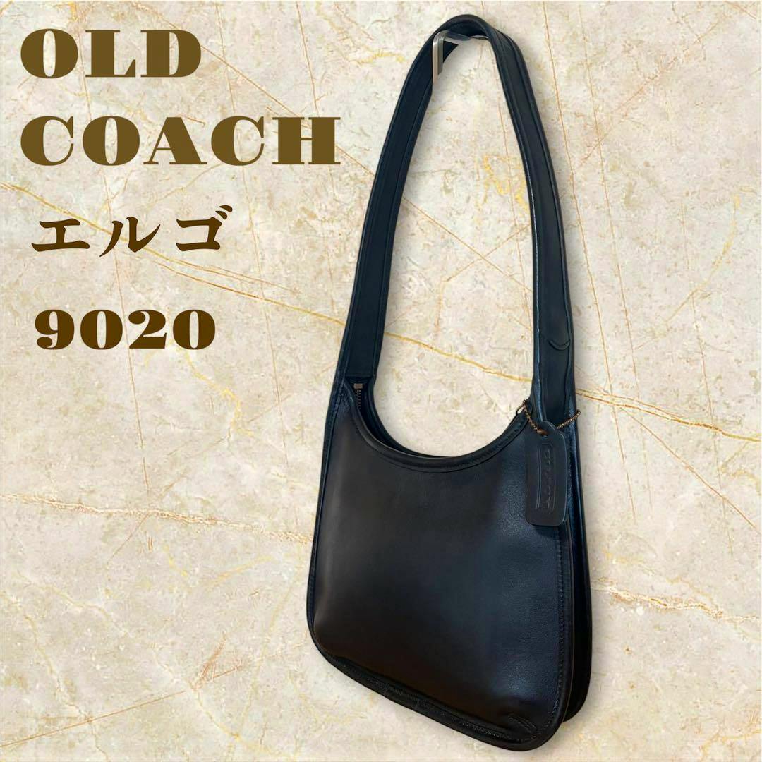 Black Old Coach Ergo 9020 leather shoulder bag hanging against a marble-textured background with overlaid text.