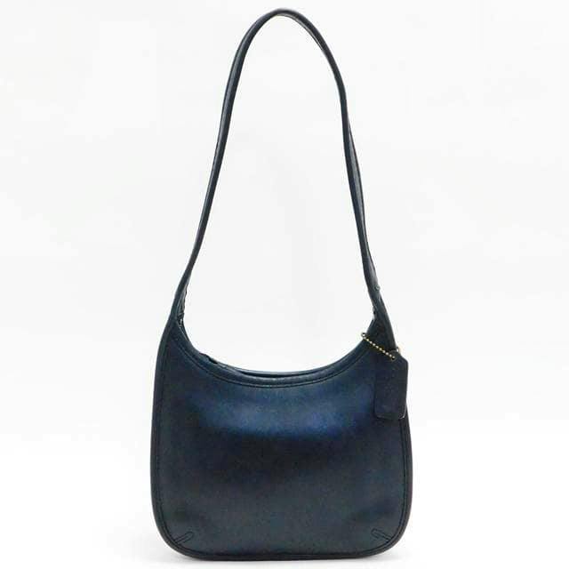 Black leather Coach Ergo shoulder handbag shown front on a white background.