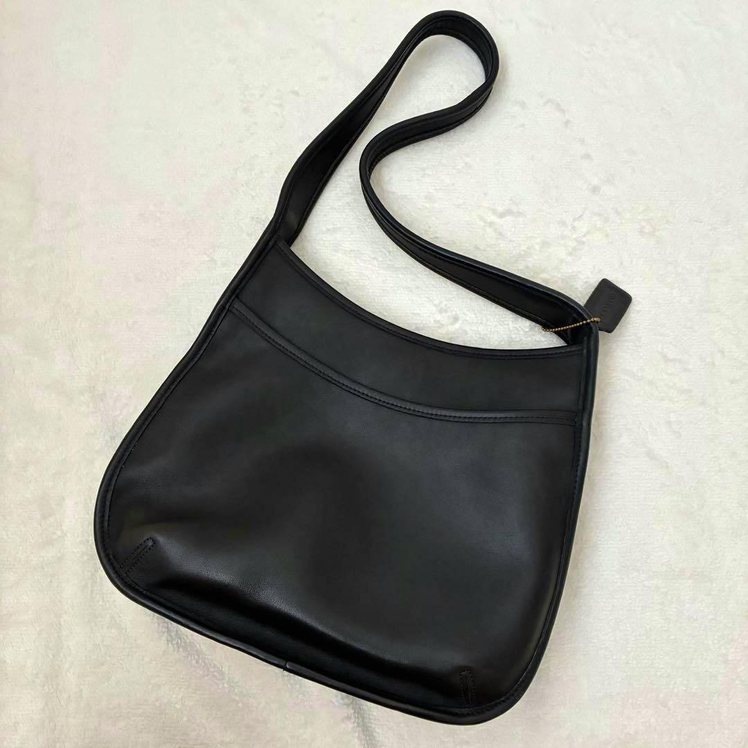 Black Coach cow leather shoulder bag (Old Coach G9D-9047) shown flat with the front and strap visible on a light background.