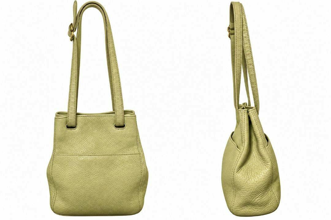 Front and side views of the OLD COACH leather shoulder handbag in light green.