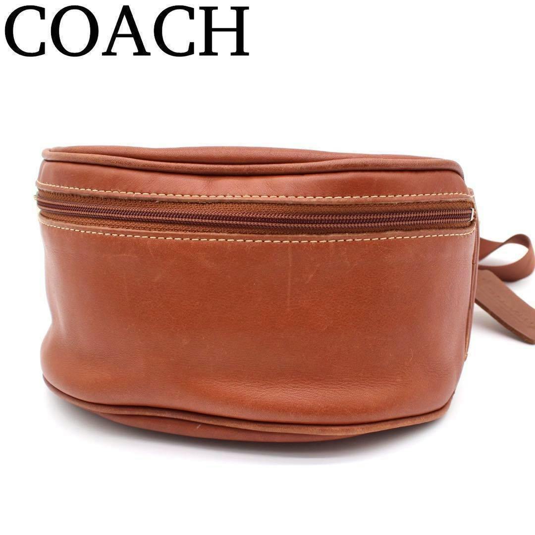 Brown Coach waist/body bag in cow leather shown from the front on a white background.