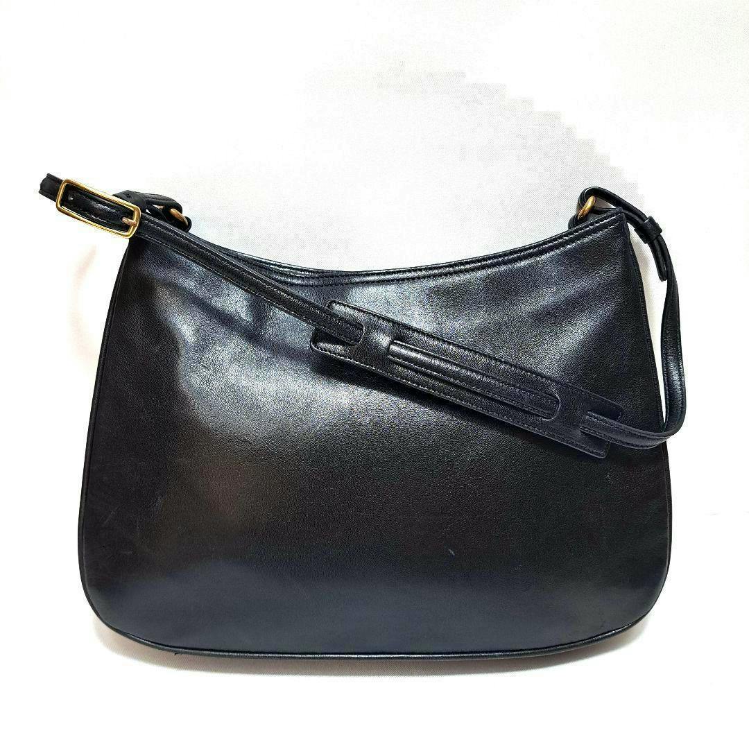 Black vintage Coach leather one-shoulder handbag shown on a white background.