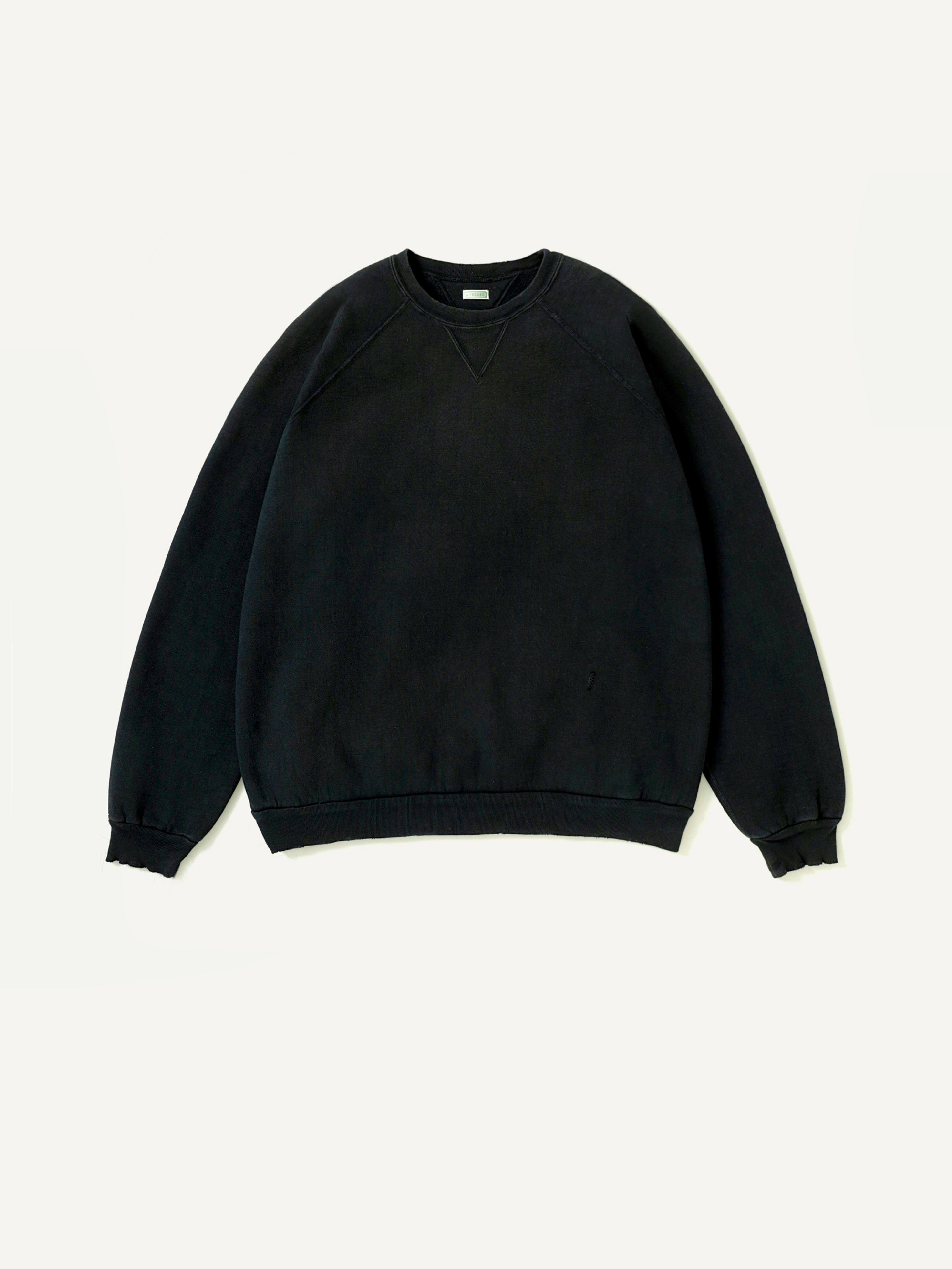 Black vintage double-V crew sweatshirt laid flat on a white background.