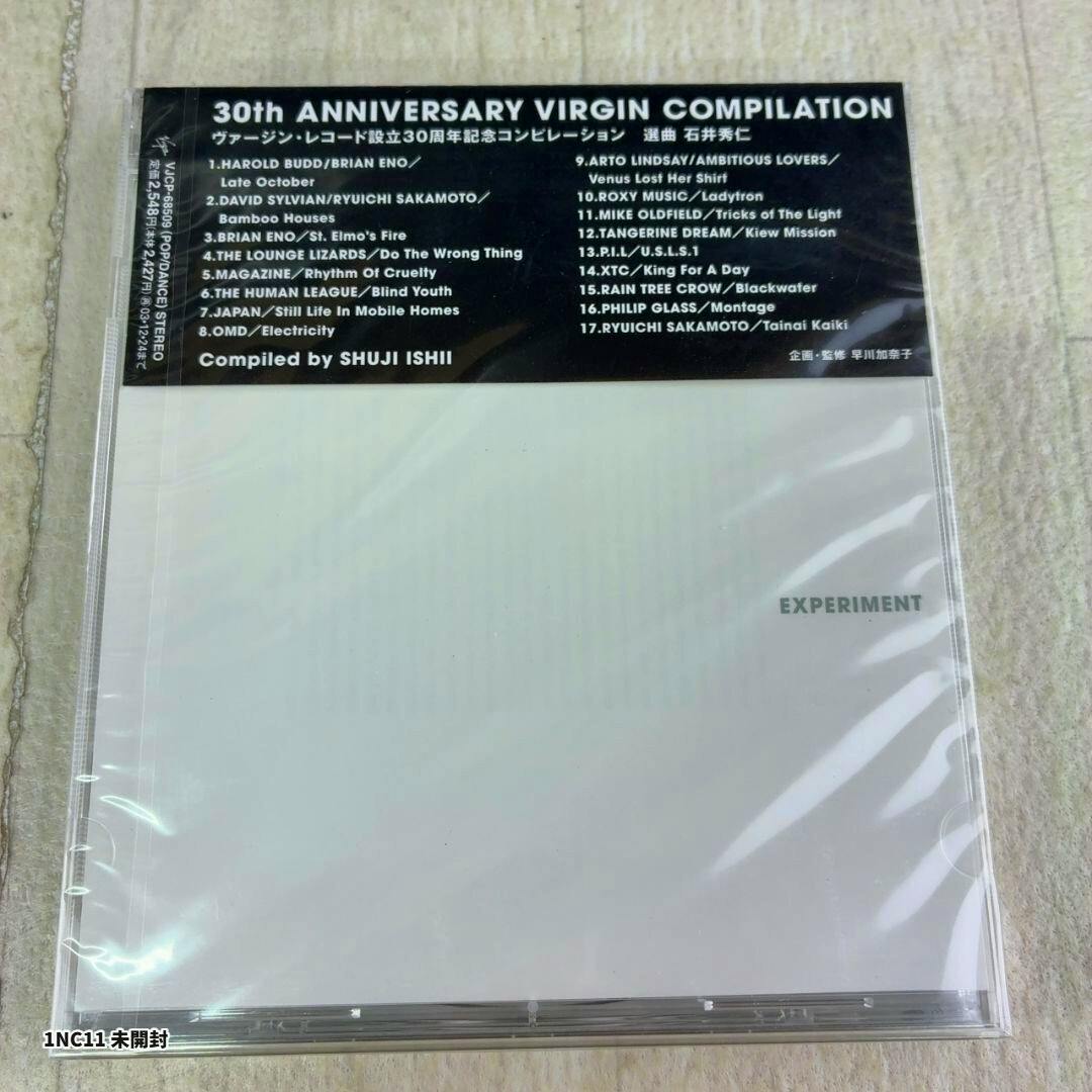 Sealed CD jewel case showing a black header with '30th ANNIVERSARY VIRGIN COMPILATION' track list and a mostly white cover with the word 'EXPERIMENT'.
