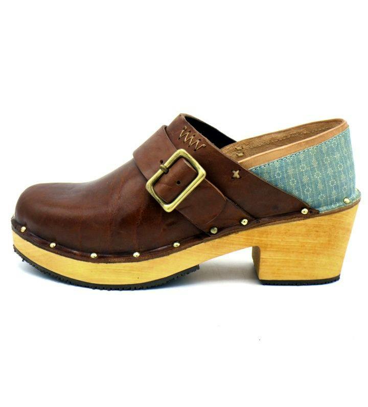 Side view of a brown leather Labrang sandal with a wooden heel, buckle strap, metal studs, and a light blue fabric heel panel.