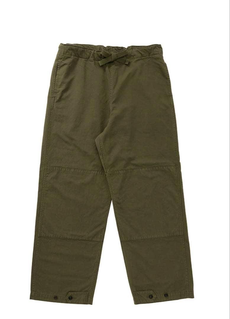 Flat-lay image of olive-colored mens visvim SHARMA MIL cotton pants on a white background.