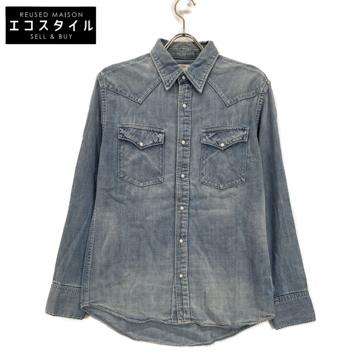 Light blue denim men's western shirt hanging on a hanger against a white background.