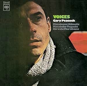 CD cover art showing a close-up portrait of a man's face with text including 'VOICES' and 'Gary Peacock'.