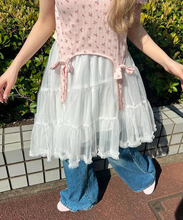Model wearing a white mid-length layered tutu skirt (women's polyester), shown from waist to feet.