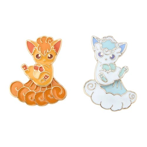 Front view of two earrings shaped like Vulpix and Alolan Vulpix characters.