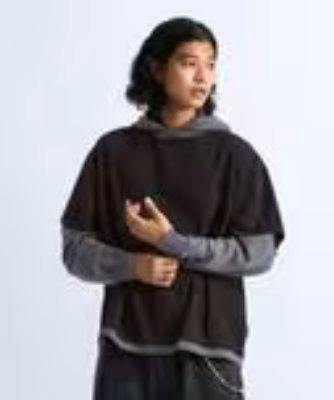 A model wearing the men's waffle-switching hoodie shown waist-up against a light background.